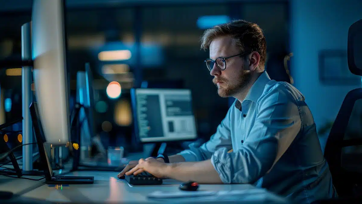 IT administrator working in an office setting up new user account